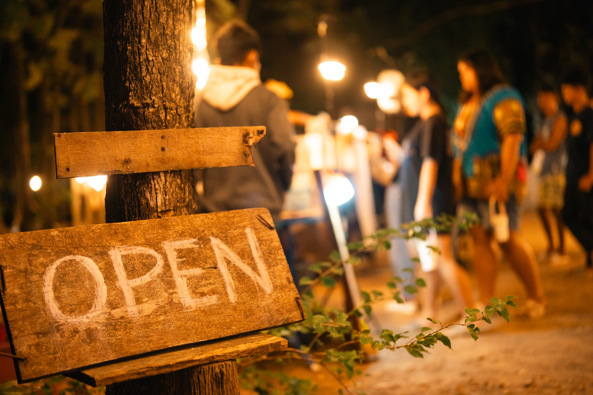 open sign board on glass door in modern cafe, morning of hotel service or restaurant retail store